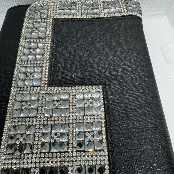 Jeweled black clutch with metal shoulder strap. - Picture 4 of 8